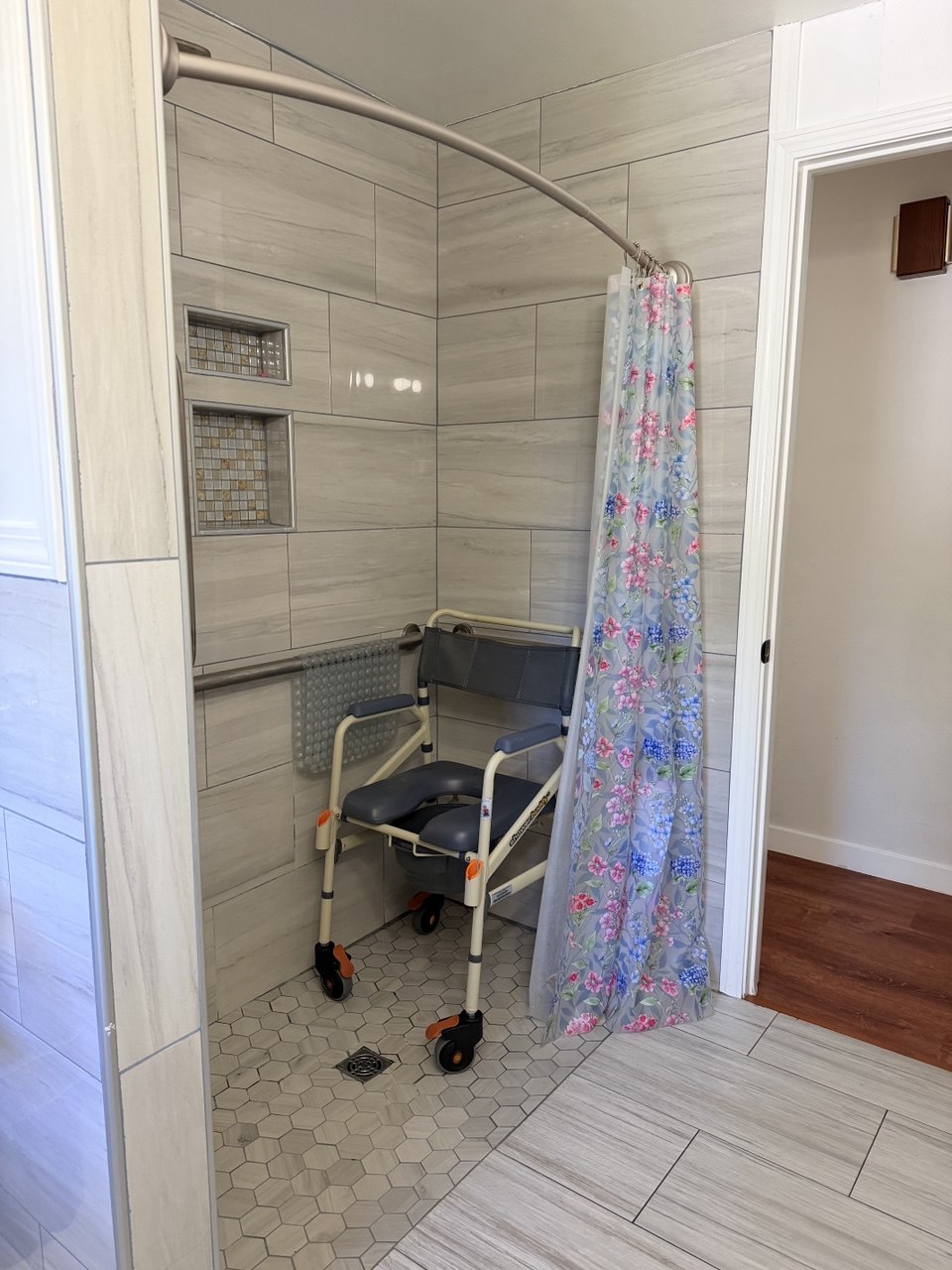 Roll-in shower with safety seat and grab bars